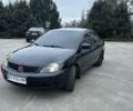 Черный Мицубиси Лансер, объемом двигателя 1.6 л и пробегом 250 тыс. км за 3500 $, фото 1 на Automoto.ua