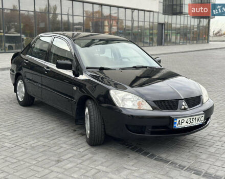 Чорний Міцубісі Lancer, об'ємом двигуна 1.58 л та пробігом 128 тис. км за 5999 $, фото 2 на Automoto.ua