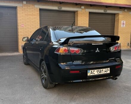 Чорний Міцубісі Lancer, об'ємом двигуна 2 л та пробігом 209 тис. км за 7600 $, фото 4 на Automoto.ua