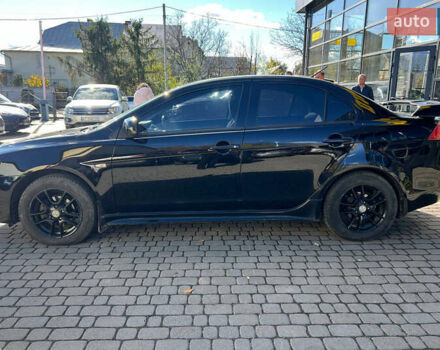 Черный Мицубиси Лансер, объемом двигателя 2 л и пробегом 215 тыс. км за 7000 $, фото 3 на Automoto.ua