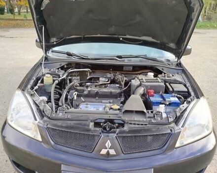 Черный Мицубиси Лансер, объемом двигателя 1.58 л и пробегом 78 тыс. км за 6500 $, фото 10 на Automoto.ua