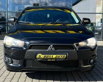 Черный Мицубиси Лансер, объемом двигателя 2 л и пробегом 215 тыс. км за 7000 $, фото 1 на Automoto.ua