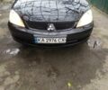 Черный Мицубиси Лансер, объемом двигателя 1.6 л и пробегом 245 тыс. км за 4000 $, фото 1 на Automoto.ua