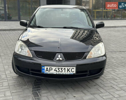 Чорний Міцубісі Lancer, об'ємом двигуна 1.58 л та пробігом 128 тис. км за 5999 $, фото 1 на Automoto.ua