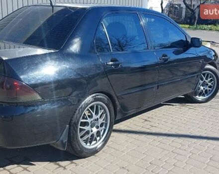 Чорний Міцубісі Lancer, об'ємом двигуна 1.58 л та пробігом 345 тис. км за 4500 $, фото 4 на Automoto.ua