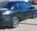 Чорний Міцубісі Lancer, об'ємом двигуна 1.58 л та пробігом 345 тис. км за 4500 $, фото 4 на Automoto.ua