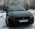 Черный Мицубиси Лансер, объемом двигателя 1.5 л и пробегом 247 тыс. км за 6900 $, фото 1 на Automoto.ua