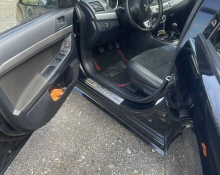 Черный Мицубиси Лансер, объемом двигателя 2 л и пробегом 201 тыс. км за 7000 $, фото 6 на Automoto.ua