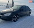 Черный Мицубиси Лансер, объемом двигателя 1.6 л и пробегом 64 тыс. км за 6999 $, фото 1 на Automoto.ua