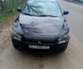 Черный Мицубиси Лансер, объемом двигателя 2 л и пробегом 140 тыс. км за 6850 $, фото 1 на Automoto.ua