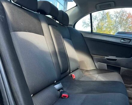 Черный Мицубиси Лансер, объемом двигателя 2 л и пробегом 215 тыс. км за 7000 $, фото 18 на Automoto.ua