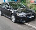 Черный Мицубиси Лансер, объемом двигателя 2 л и пробегом 241 тыс. км за 6750 $, фото 1 на Automoto.ua