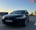 Черный Мицубиси Лансер, объемом двигателя 2 л и пробегом 233 тыс. км за 6399 $, фото 1 на Automoto.ua