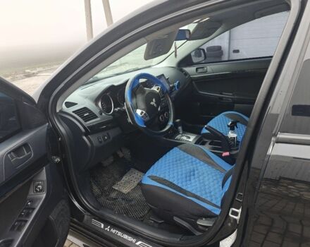 Черный Мицубиси Лансер, объемом двигателя 2 л и пробегом 228 тыс. км за 7000 $, фото 5 на Automoto.ua