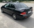 Черный Мицубиси Лансер, объемом двигателя 1.58 л и пробегом 240 тыс. км за 5100 $, фото 4 на Automoto.ua