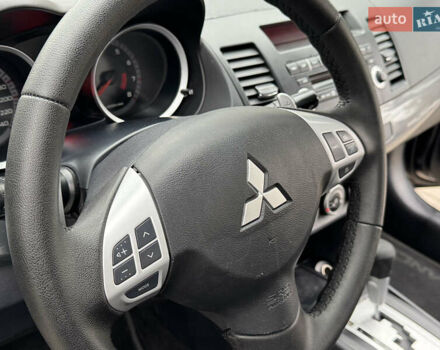 Черный Мицубиси Лансер, объемом двигателя 2 л и пробегом 221 тыс. км за 6750 $, фото 39 на Automoto.ua