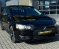 Черный Мицубиси Лансер, объемом двигателя 2 л и пробегом 215 тыс. км за 7000 $, фото 1 на Automoto.ua