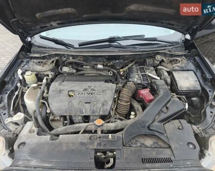 Черный Мицубиси Лансер, объемом двигателя 2 л и пробегом 228 тыс. км за 7000 $, фото 10 на Automoto.ua