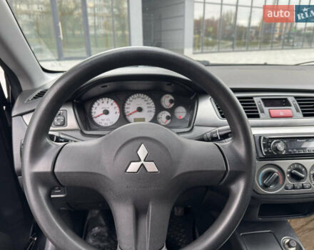 Чорний Міцубісі Lancer, об'ємом двигуна 1.58 л та пробігом 128 тис. км за 5999 $, фото 9 на Automoto.ua