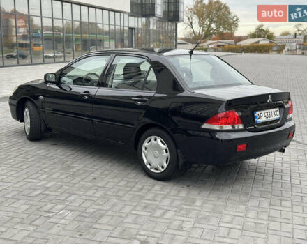 Чорний Міцубісі Lancer, об'ємом двигуна 1.58 л та пробігом 128 тис. км за 5999 $, фото 6 на Automoto.ua