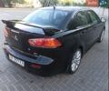 Черный Мицубиси Лансер, объемом двигателя 2 л и пробегом 220 тыс. км за 7999 $, фото 1 на Automoto.ua