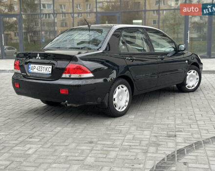 Чорний Міцубісі Lancer, об'ємом двигуна 1.58 л та пробігом 128 тис. км за 5999 $, фото 5 на Automoto.ua
