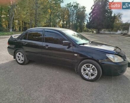 Черный Мицубиси Лансер, объемом двигателя 1.58 л и пробегом 78 тыс. км за 6500 $, фото 9 на Automoto.ua