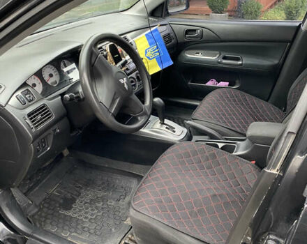 Чорний Міцубісі Lancer, об'ємом двигуна 1.58 л та пробігом 287 тис. км за 4750 $, фото 8 на Automoto.ua