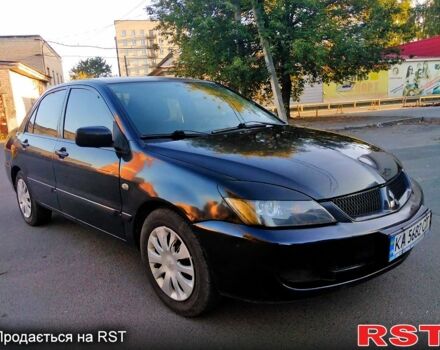 Чорний Міцубісі Lancer, об'ємом двигуна 1.6 л та пробігом 296 тис. км за 3650 $, фото 4 на Automoto.ua