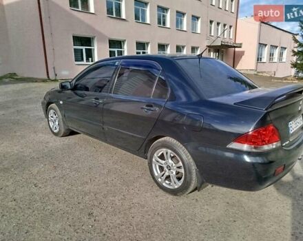 Черный Мицубиси Лансер, объемом двигателя 1.58 л и пробегом 78 тыс. км за 6500 $, фото 3 на Automoto.ua