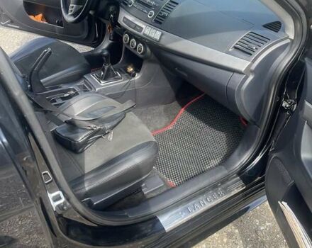 Черный Мицубиси Лансер, объемом двигателя 2 л и пробегом 201 тыс. км за 7000 $, фото 7 на Automoto.ua