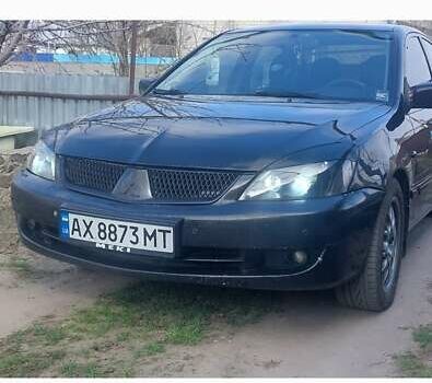 Чорний Міцубісі Lancer, об'ємом двигуна 1.58 л та пробігом 345 тис. км за 4500 $, фото 5 на Automoto.ua