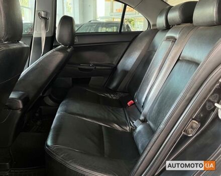 Черный Мицубиси Лансер, объемом двигателя 1.5 л и пробегом 245 тыс. км за 5100 $, фото 12 на Automoto.ua