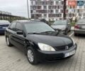 Черный Мицубиси Лансер, объемом двигателя 1.6 л и пробегом 186 тыс. км за 4500 $, фото 1 на Automoto.ua