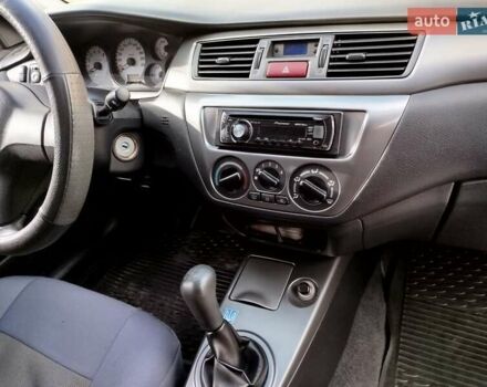 Черный Мицубиси Лансер, объемом двигателя 1.58 л и пробегом 78 тыс. км за 6500 $, фото 24 на Automoto.ua