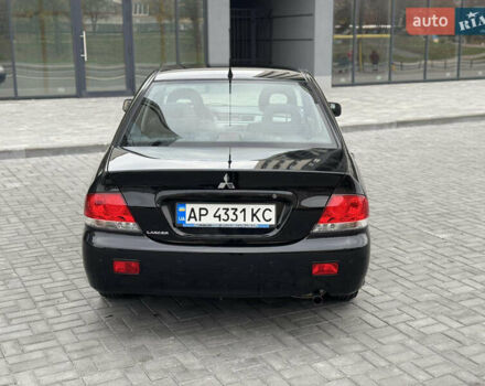 Чорний Міцубісі Lancer, об'ємом двигуна 1.58 л та пробігом 128 тис. км за 5999 $, фото 34 на Automoto.ua