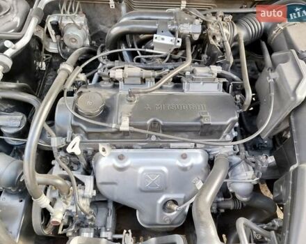 Черный Мицубиси Лансер, объемом двигателя 1.58 л и пробегом 78 тыс. км за 6500 $, фото 13 на Automoto.ua