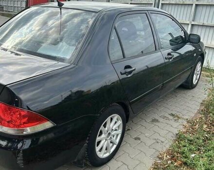 Чорний Міцубісі Lancer, об'ємом двигуна 1.6 л та пробігом 220 тис. км за 3000 $, фото 4 на Automoto.ua