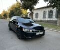 Черный Мицубиси Лансер, объемом двигателя 1.5 л и пробегом 158 тыс. км за 5500 $, фото 1 на Automoto.ua