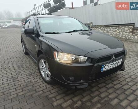 Черный Мицубиси Лансер, объемом двигателя 2 л и пробегом 228 тыс. км за 7000 $, фото 1 на Automoto.ua