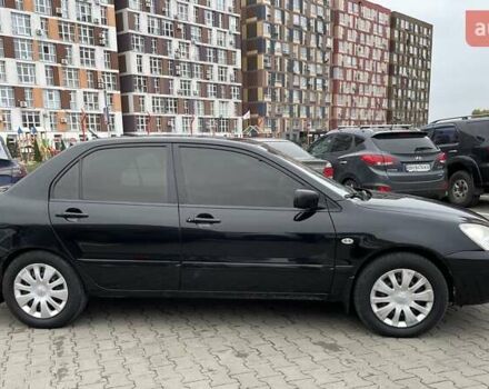 Чорний Міцубісі Lancer, об'ємом двигуна 1.6 л та пробігом 186 тис. км за 5500 $, фото 3 на Automoto.ua