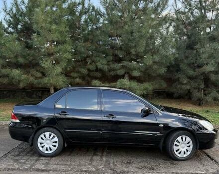 Чорний Міцубісі Lancer, об'ємом двигуна 1.6 л та пробігом 98 тис. км за 5600 $, фото 13 на Automoto.ua