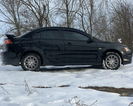 Чорний Міцубісі Lancer, об'ємом двигуна 2 л та пробігом 200 тис. км за 7200 $, фото 5 на Automoto.ua