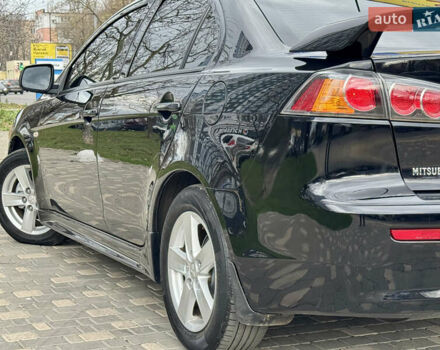 Черный Мицубиси Лансер, объемом двигателя 2 л и пробегом 221 тыс. км за 6750 $, фото 16 на Automoto.ua