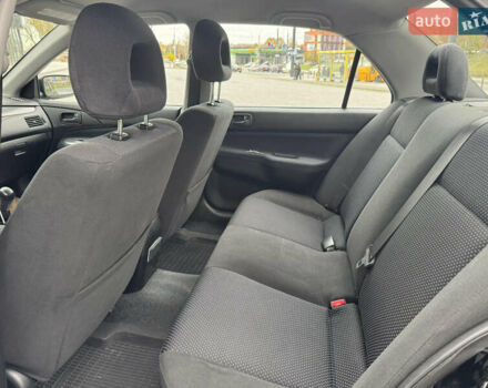 Чорний Міцубісі Lancer, об'ємом двигуна 1.58 л та пробігом 128 тис. км за 5999 $, фото 24 на Automoto.ua