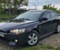 Чорний Міцубісі Lancer, об'ємом двигуна 2 л та пробігом 235 тис. км за 6500 $, фото 1 на Automoto.ua