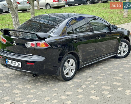 Черный Мицубиси Лансер, объемом двигателя 2 л и пробегом 221 тыс. км за 6750 $, фото 21 на Automoto.ua
