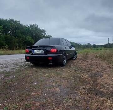 Чорний Міцубісі Lancer, об'ємом двигуна 1.58 л та пробігом 345 тис. км за 4500 $, фото 6 на Automoto.ua