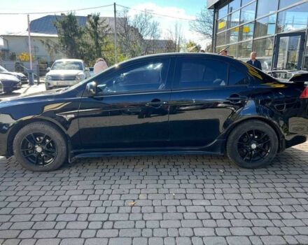 Черный Мицубиси Лансер, объемом двигателя 2 л и пробегом 215 тыс. км за 7000 $, фото 3 на Automoto.ua