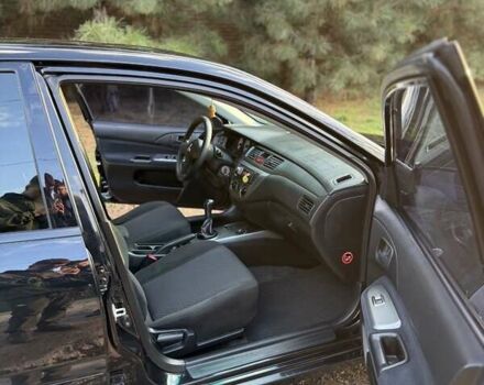 Чорний Міцубісі Lancer, об'ємом двигуна 1.6 л та пробігом 98 тис. км за 5600 $, фото 21 на Automoto.ua